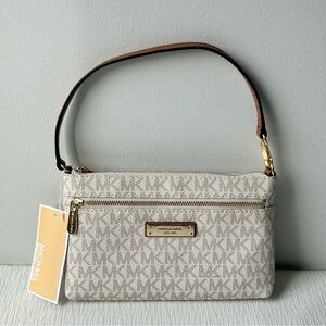 Michael Kors Jet Set Large Wristlet in the vanilla logo print